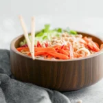 Colorful Thai salad with noodles, cabbage, and fresh vegetables