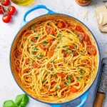 Delicious bowl of homemade Tomato Basil Pasta topped with fresh basil