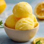 A bowl of zesty lemonade sorbet, refreshing and tangy for summer days.