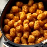 Crispy air fryer tater tots served in a bowl