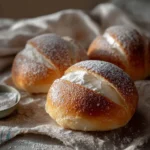 Delicious authentic Roman Maritozzi filled with cream and served on a plate