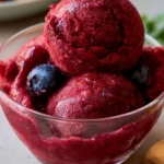 Delicious blueberry peach sorbet served in a bowl with fresh fruit