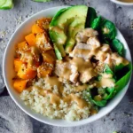 Colorful Buddha Bowl with fresh vegetables, grains, and toppings for a healthy meal
