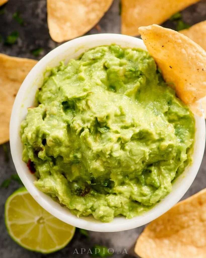 Bowl of homemade Chipotle-style guacamole with fresh ingredients