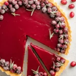 A delicious, easy cranberry tart garnished with fresh cranberries and mint.