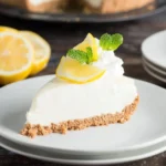 Frozen Lemon Pie topped with whipped cream and lemon zest