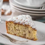 Delicious homemade zucchini cake with cream cheese frosting on a plate