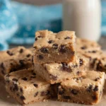 Homemade peanut butter bars displayed on a wooden table