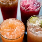 Colorful dirty soda drinks with various flavors and garnishes.