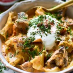 Bowl of creamy Vegetarian Stroganoff with mushrooms and pasta.