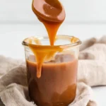 A delicious homemade 3-Ingredient Keto Caramel Sauce in a jar.