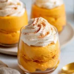 Delicious bowl of 3 Ingredient Pumpkin Fluff dessert with autumn decorations.