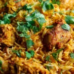 Delicious easy chicken biryani served in a bowl with spices and herbs.