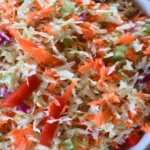Bowl of homemade freezer slaw ready for freezing and meal prep