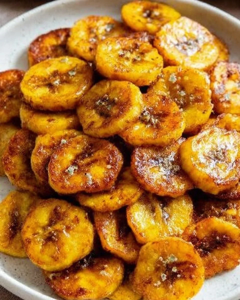 Plate of golden fried sweet plantains served as a tasty side dish.