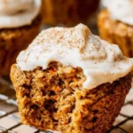 Freshly baked healthy carrot cake muffins topped with nuts and spices