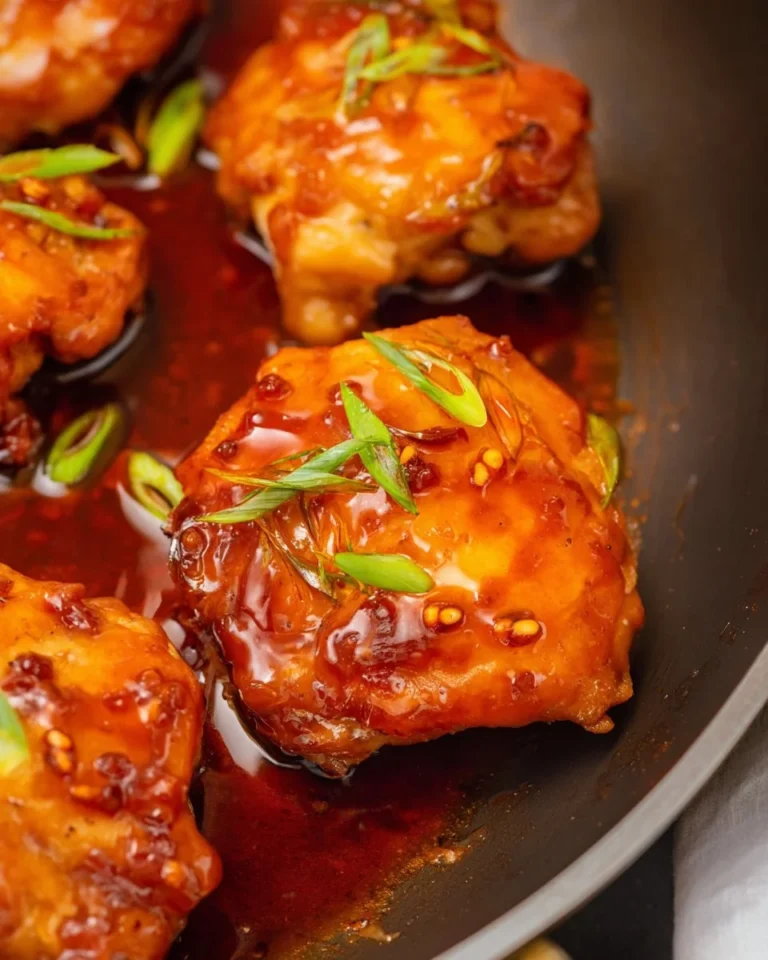 Honey Sriracha Chicken dish with garnishes.