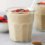 Healthy overnight oats served in a jar with fresh fruits and nuts.