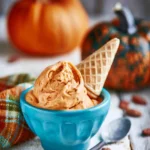 A bowl of creamy Pumpkin Ice Cream topped with cinnamon, perfect for fall.