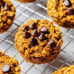 Freshly baked Pumpkin Oatmeal Muffins on a wooden table