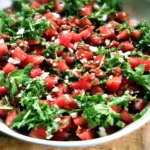 A vibrant watermelon feta salad with mint on a plate