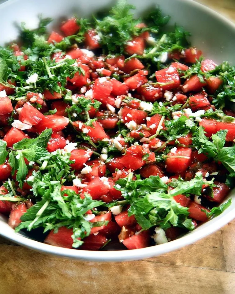 A vibrant watermelon feta salad with mint on a plate