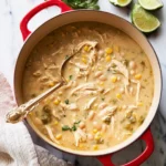 Bowl of White Chicken Chili garnished with cilantro and lime