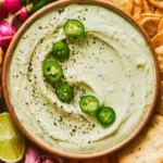 Creamy jalapeno cottage cheese dip served in a bowl with tortilla chips